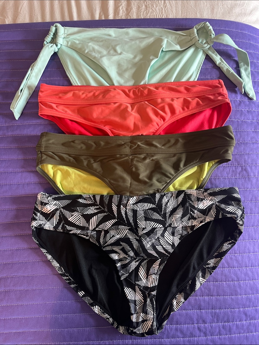 Four Prana bikini bottoms.  Size medium.